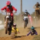 Action shot of a motocross athlete soaring through the air, highlighting the adrenaline and precision of the sport
