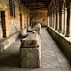 The Gothic cloister of Tréguier Cathedral in Brittany, showing the perspective of the stone gallery and medieval recumbent effigies